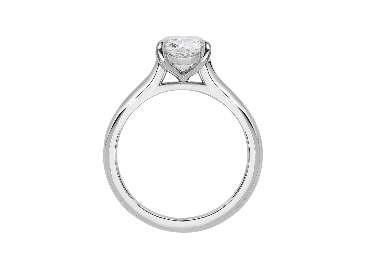A.G cushion cut solitaire with a round profile band.