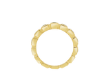 Front view of A.G baguette cut bezel set eternity band with green sapphires and yellow gold.