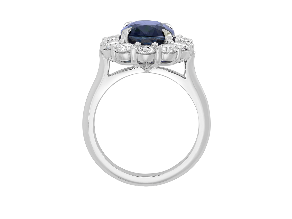 A.G oval cut Ceylon sapphire and diamond cluster ring