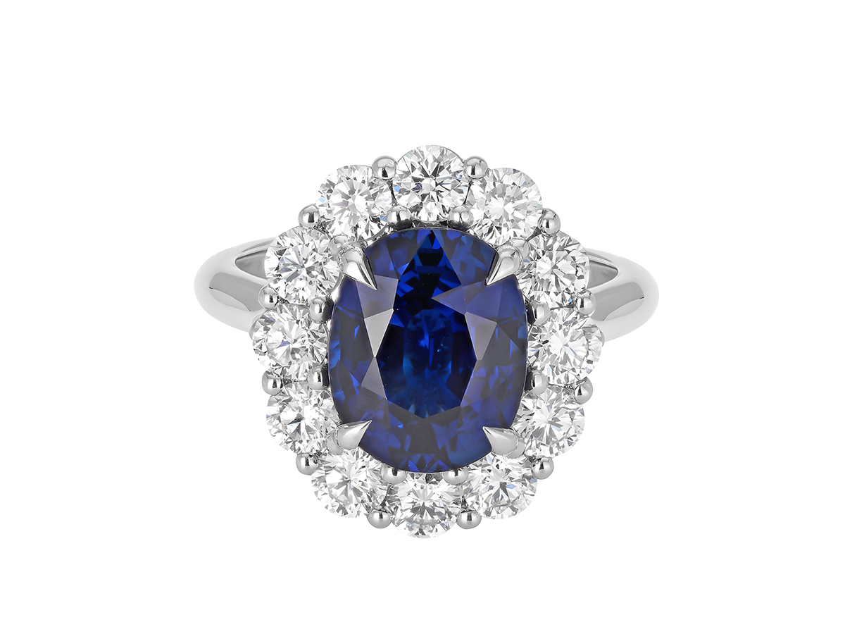 A.G oval cut Ceylon sapphire and diamond cluster ring