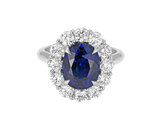 A.G oval cut Ceylon sapphire and diamond cluster ring