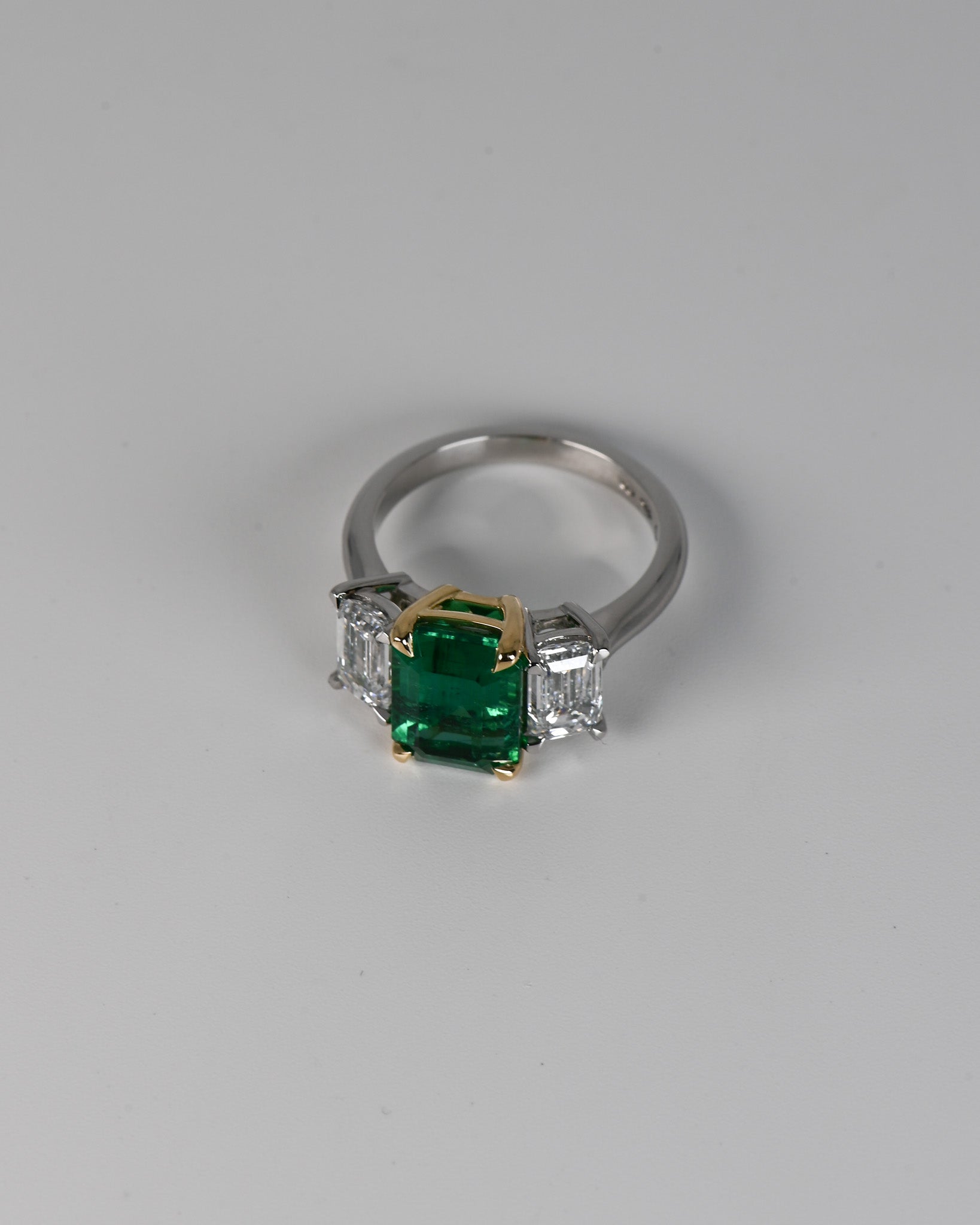 Top view of Emerald and Diamond Trilogy Ring