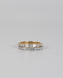 Gold and silver A.G alternating diamond wedding bands stacked on each other.