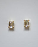A pair of Emerald Cut Yellow Diamond Studs