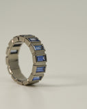 A.G Designer Jeweller custom made blue sapphire bezel set ring on side.