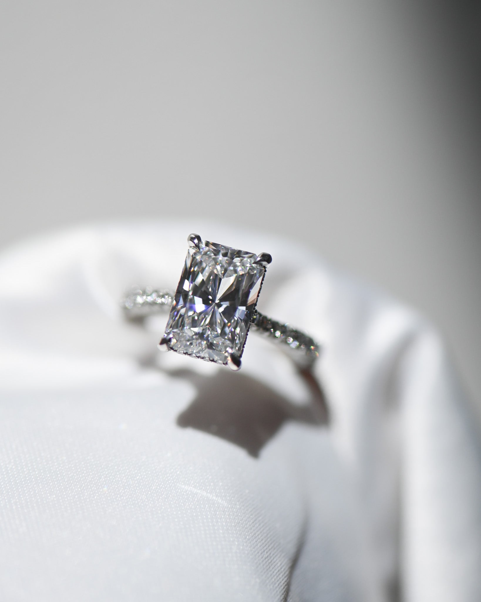 A.G 3.01ct radiant cut diamond engagement ring in satin ring box.