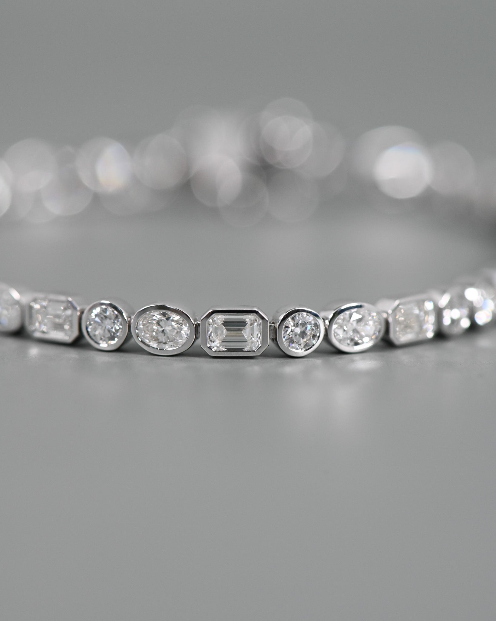 Close up of bezel diamonds in Tri Diamond Bezel Bracekelt.