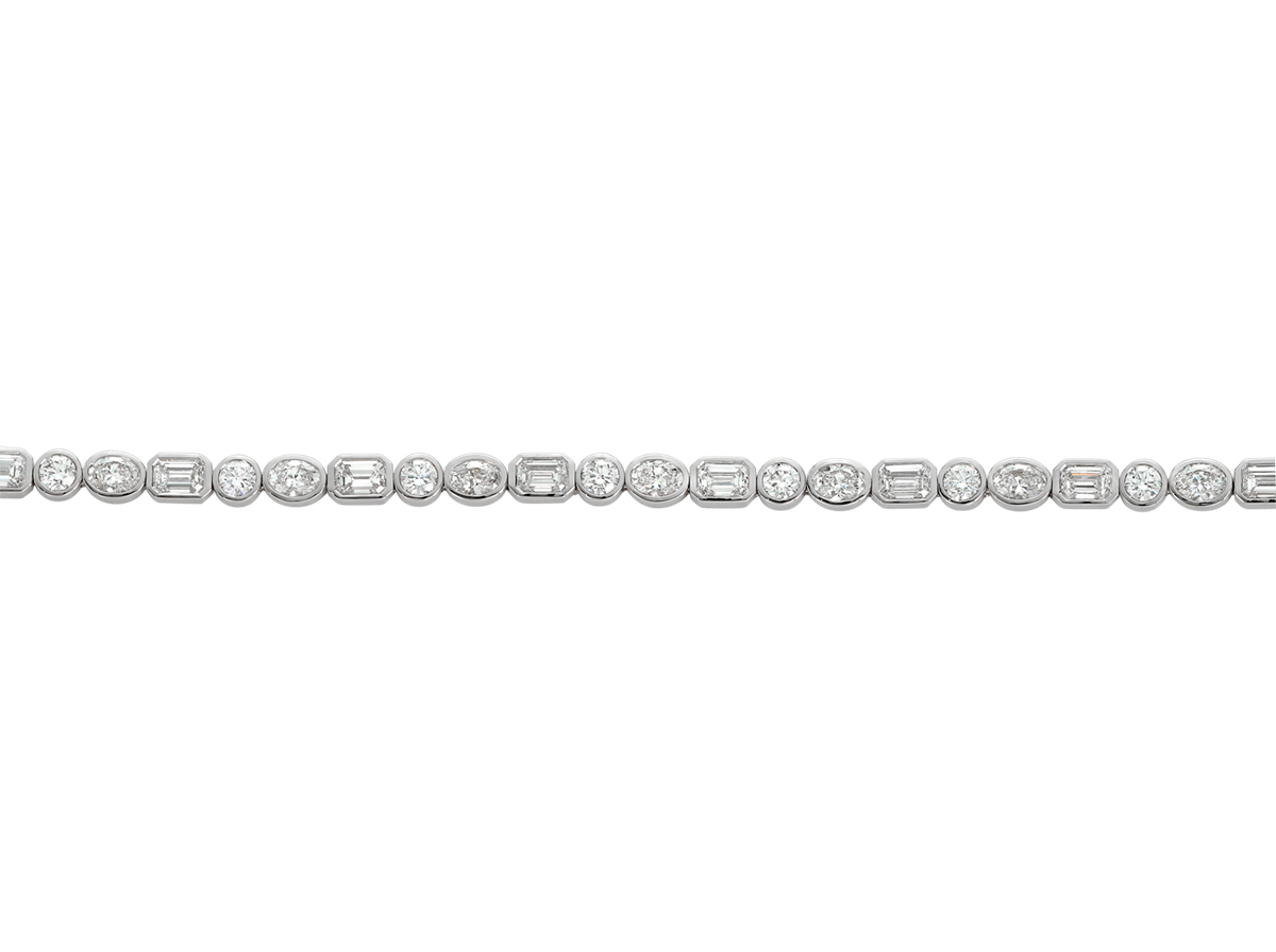 A.G Designer Jeweller custom made alternating tri diamond tennis bracelet in white gold.