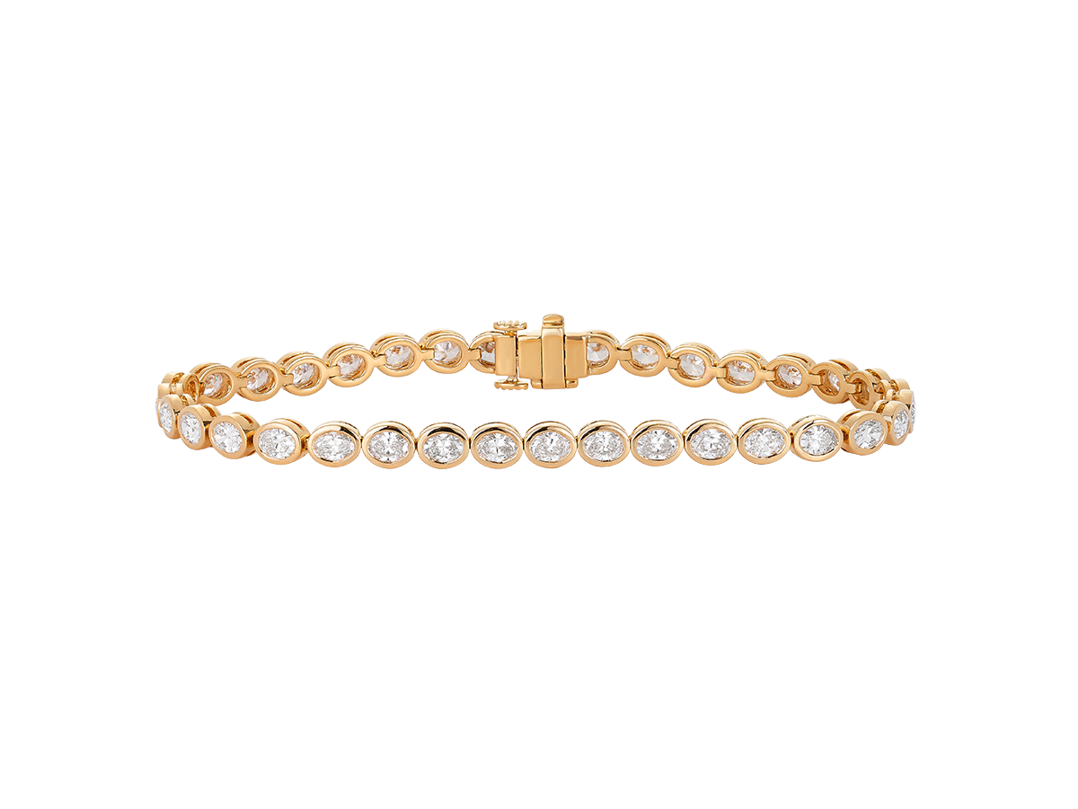 A.G bezel set oval diamond tennis bracelet in yellow gold.