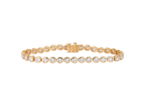 A.G bezel set oval diamond tennis bracelet in yellow gold.