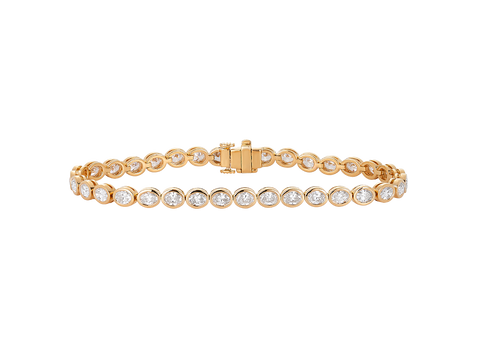A.G bezel set oval diamond tennis bracelet in yellow gold.