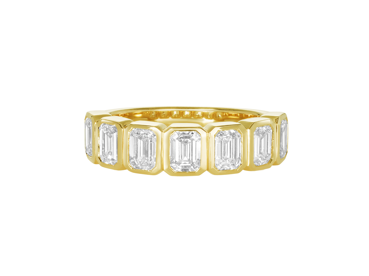 A.G Designer Jeweller custom made emerald cut diamond bezel set eternity band in yellow gold.
