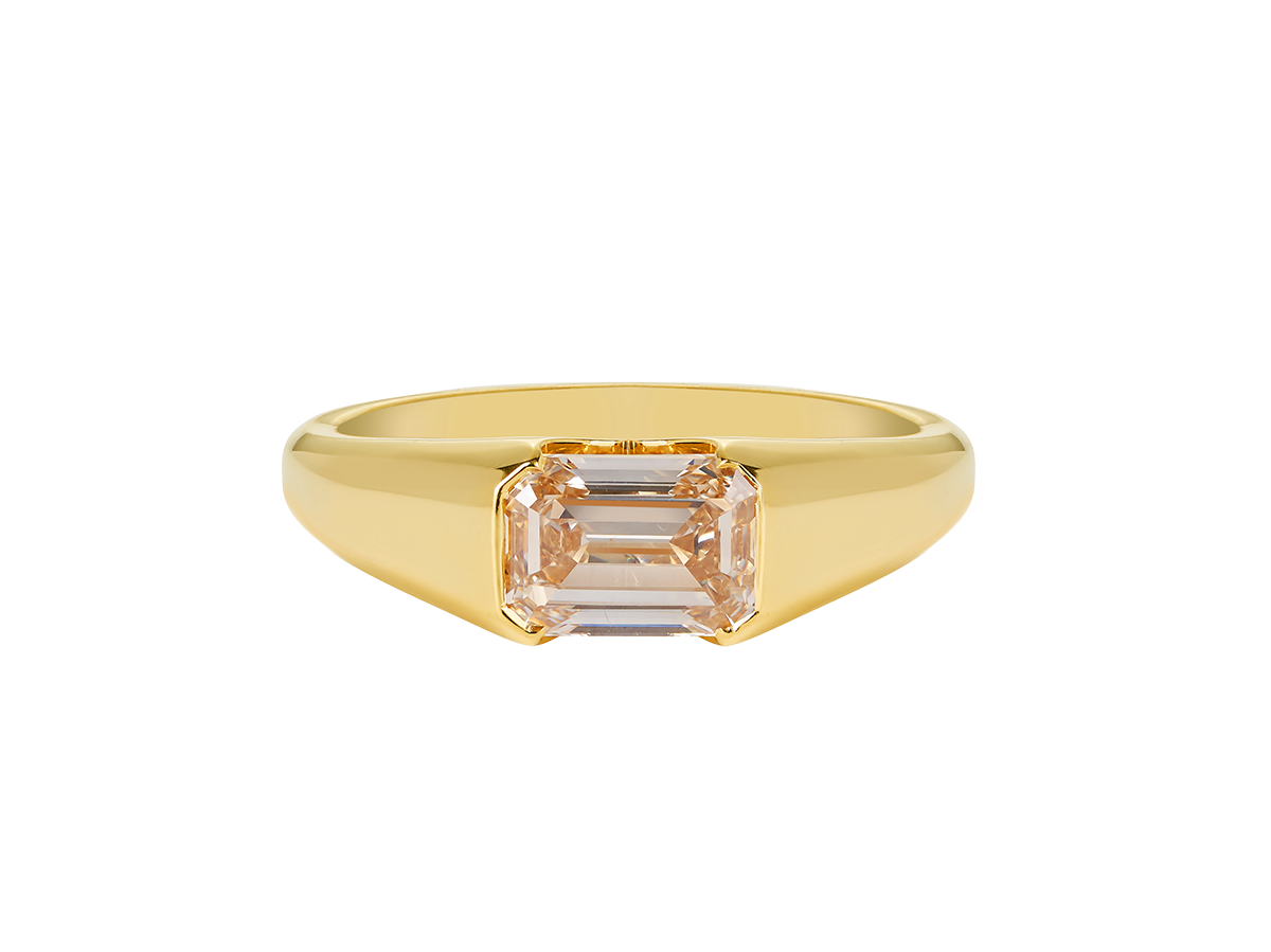 A.G custom signet ring with emerald cut champagne diamond in yellow gold.