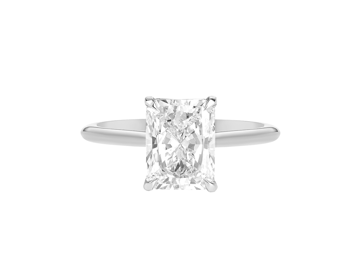 A.G radiant cut diamond solitaire setting with a fine half round band.