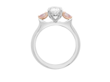 Front view of A.G oval cut diamond with pear cut side diamonds in a half round band.