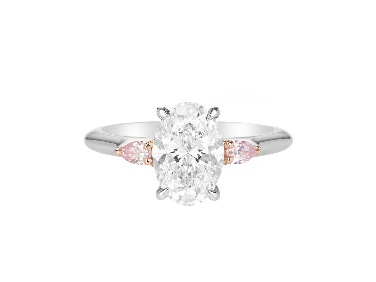A.G oval cut diamond with pear cut side diamonds in a half round band.