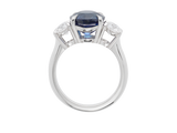 Front view of A.G round Royal Blue sapphire and diamond trilogy ring.
