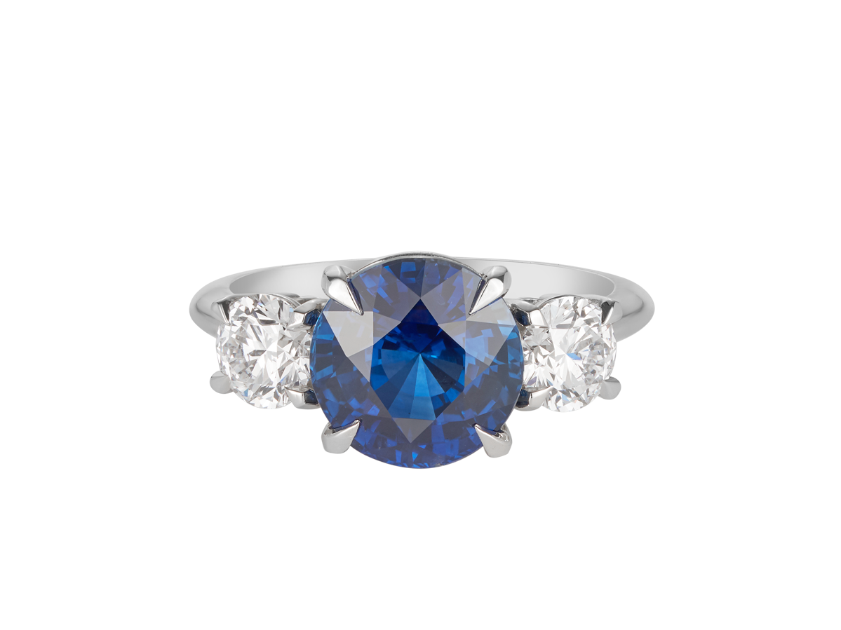 A.G round Royal Blue sapphire and diamond trilogy ring.