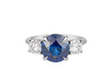 A.G round Royal Blue sapphire and diamond trilogy ring.