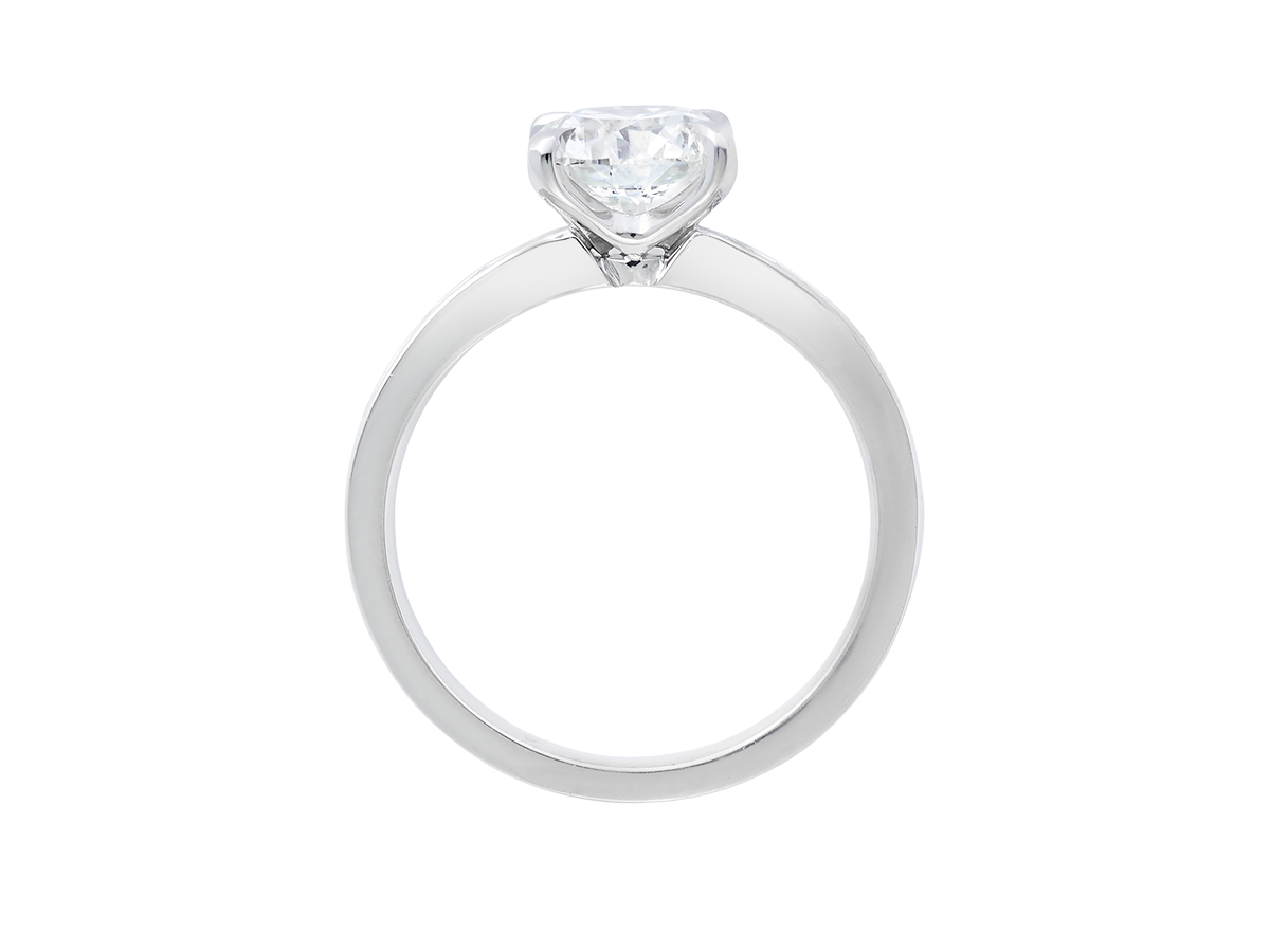 A.G round brilliant cut diamond four claw setting with channel set diamond band.