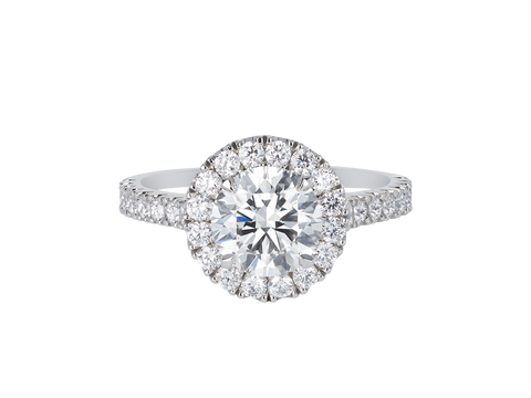 A.G round brilliant cut diamond halo setting with split bead half diamond band.