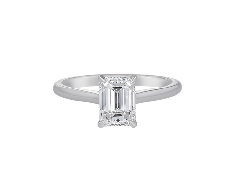 A.G emerald cut diamond solitaire four claw setting with a half round band.