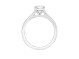 Side view of A.G emerald cut diamond solitaire four claw setting with a half round band.