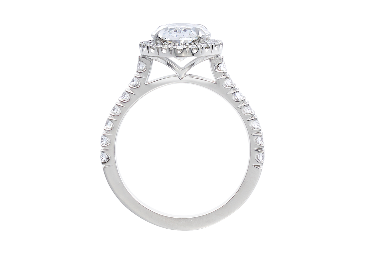 A.G oval cut diamond halo setting with split bead half diamond band.