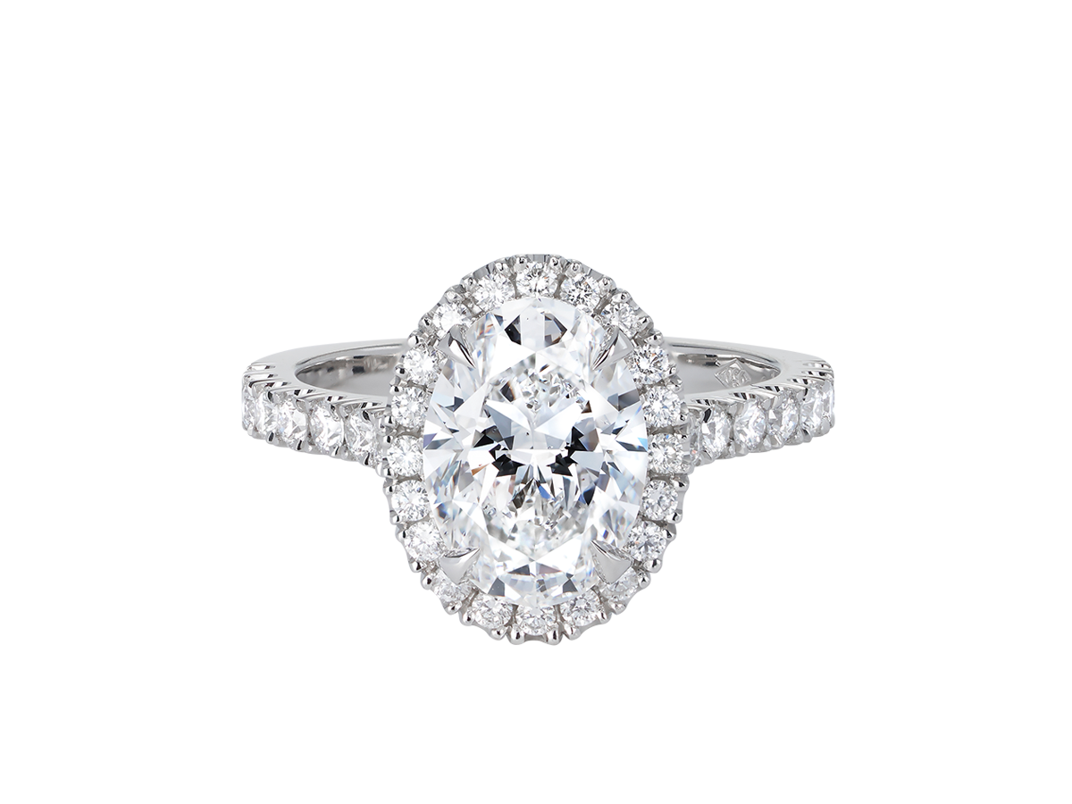 A.G oval cut diamond halo setting with split bead half diamond band.