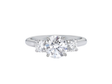 A.G round brilliant cut diamond trilogy four claw setting and half round band in silver.