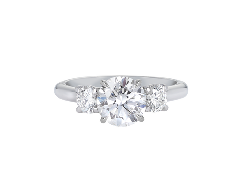 A.G round brilliant cut diamond trilogy four claw setting and half round band in silver.