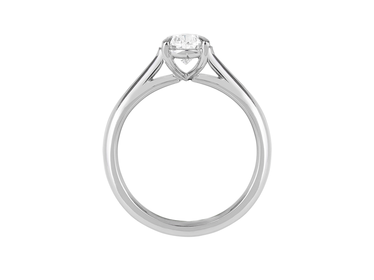 A.G pear cut diamond solitaire four claw setting with a half round band.