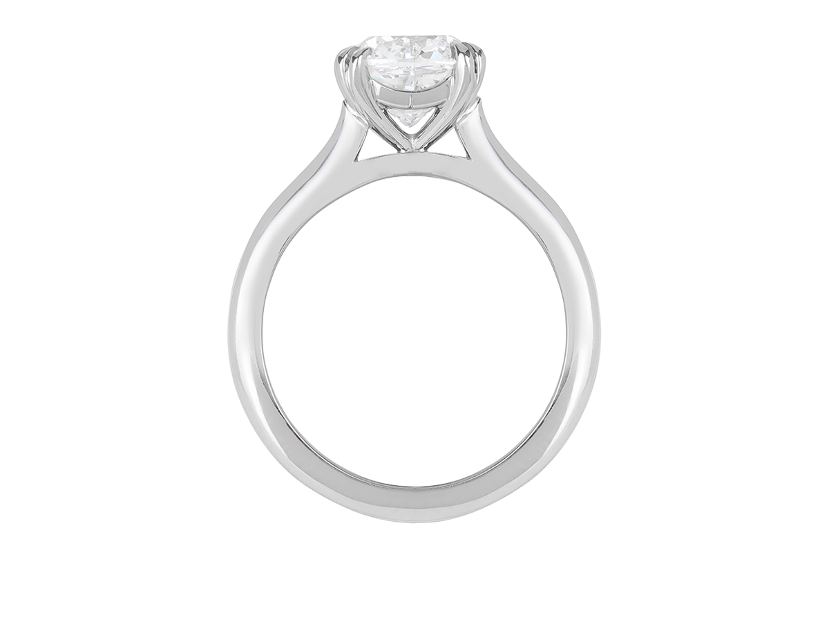 A.G cushion cut solitaire double claw setting with half round band.