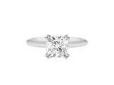 A.G cushion cut solitaire double claw setting with half round band.