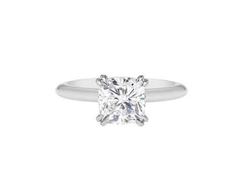 A.G cushion cut solitaire double claw setting with half round band.
