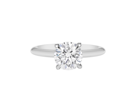 A.G round brilliant cut diamond four claw setting with a half round band.