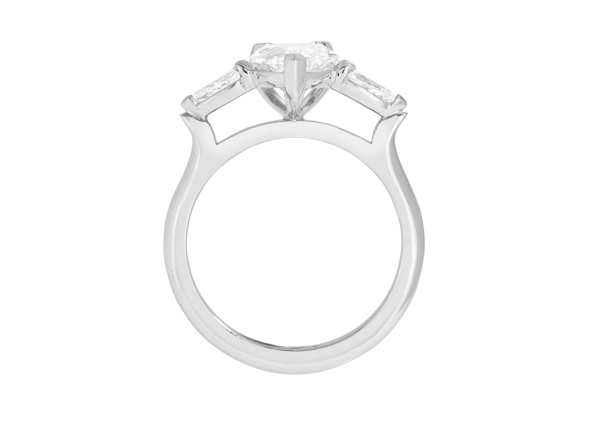 A.G pear cut diamond with pear cut side diamonds in a half round band.