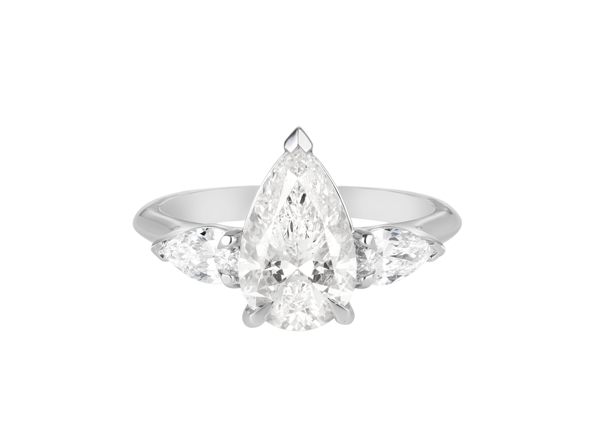 A.G pear cut diamond with pear cut side diamonds in a half round band.