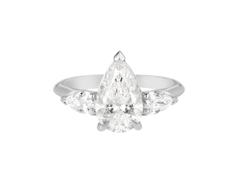A.G pear cut diamond with pear cut side diamonds in a half round band.