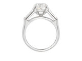 Side view of A.G oval cut and tapered baguette diamond engagement ring.