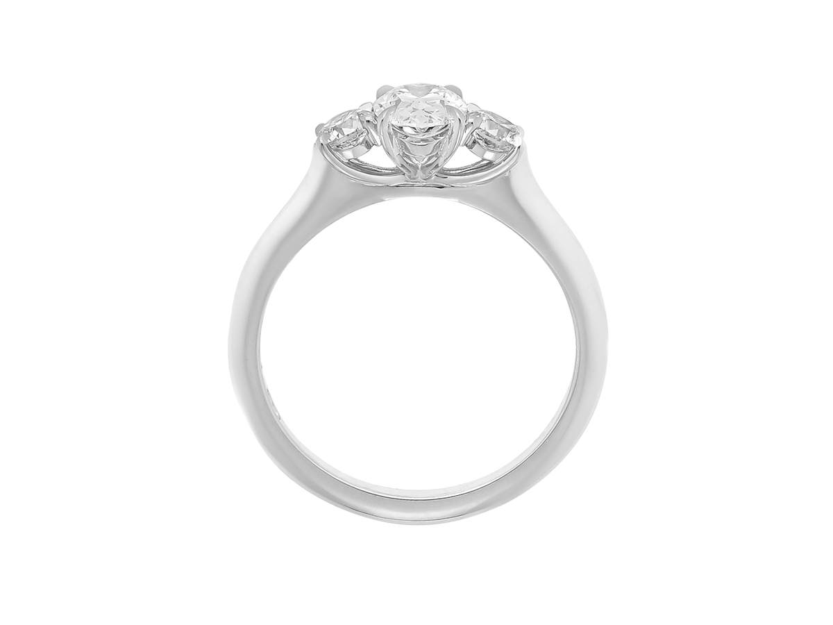 A.G oval cut and round brilliant cut diamond trilogy ring.