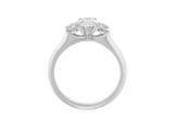 Side view of A.G oval cut and round brilliant cut diamond trilogy ring.