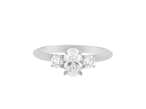 A.G oval cut and round brilliant cut diamond trilogy ring.