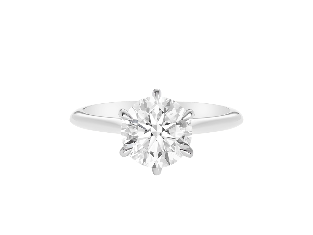 A.G round brilliant cut diamond six claw setting with swept up shoulders and a half round band.