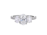 A.G oval cut trilogy with split bead diamond band.