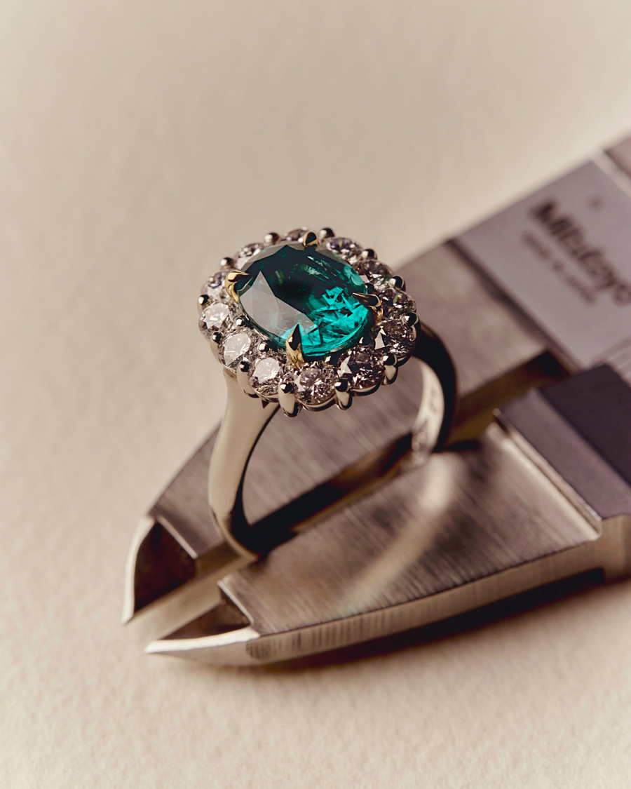 Oval Cut Emerald and Diamond Cluster Ring