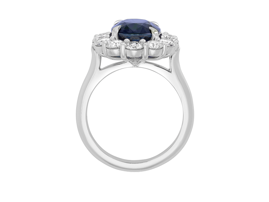 Side view of A.G oval cut Ceylon sapphire and diamond cluster ring
