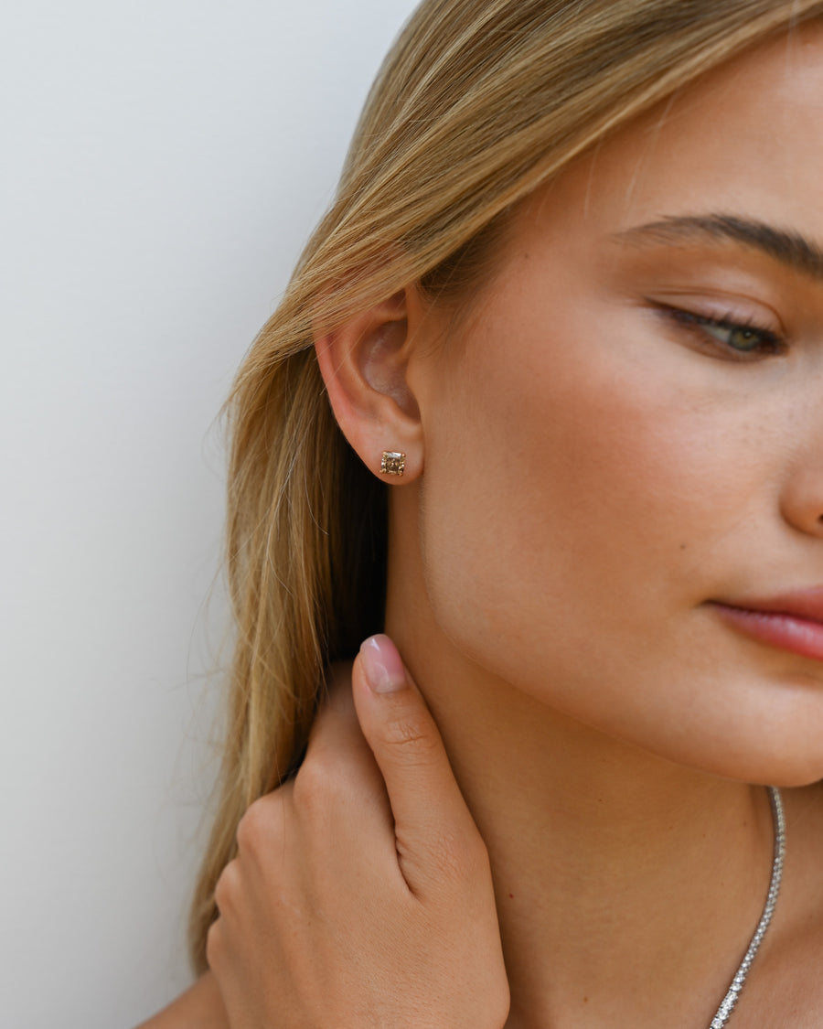 Close up of woman's ear with Champagne Diamond Studs in.