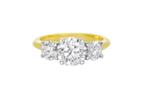A.G round brilliant cut diamond trilogy four claw setting and half round gold band.