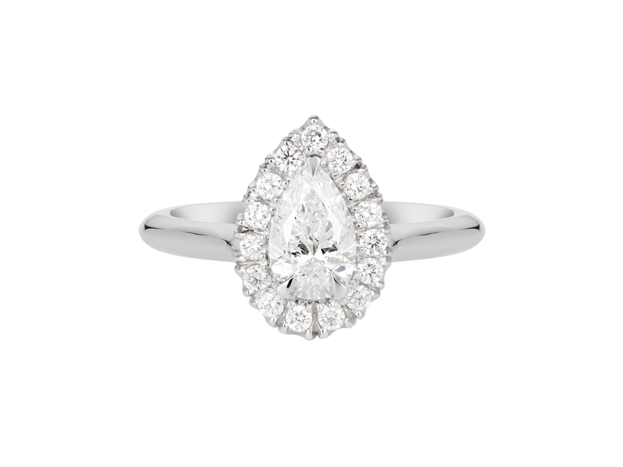 A.G pear cut diamond halo setting with half round band. 